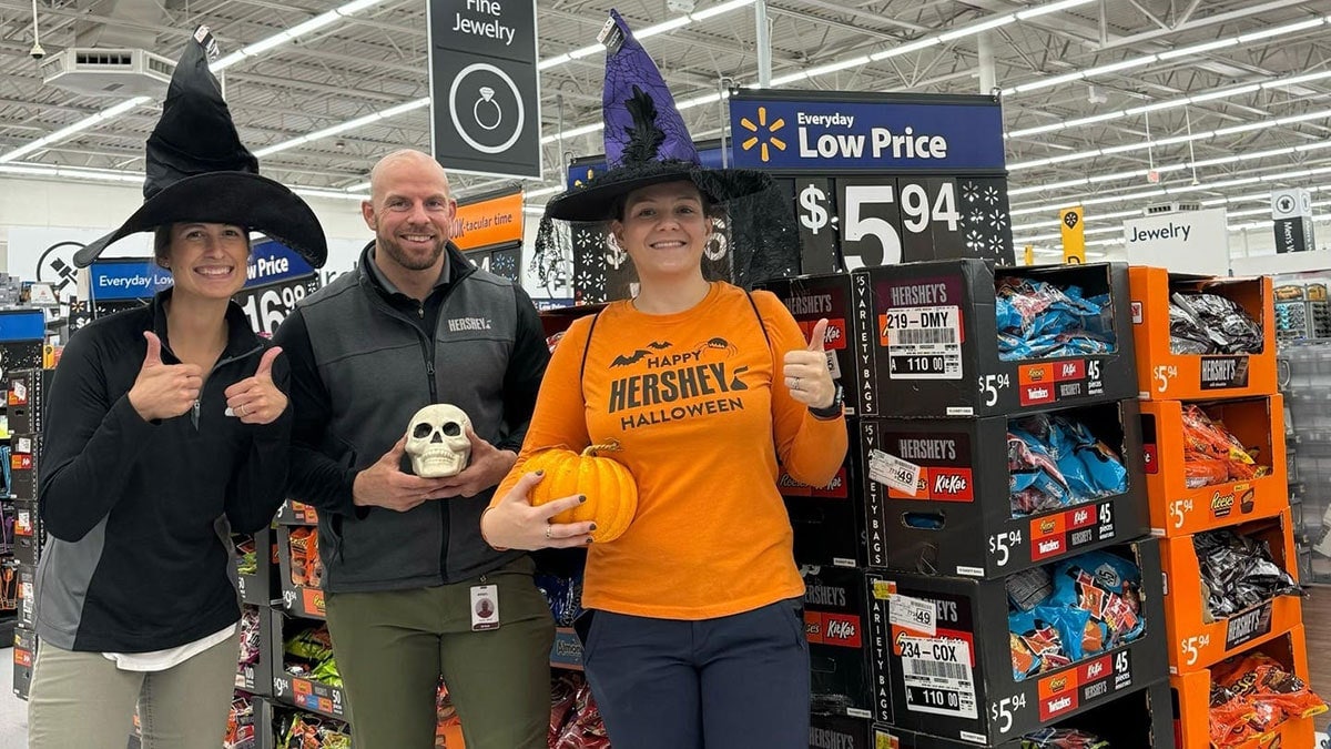 Employees helping out in store