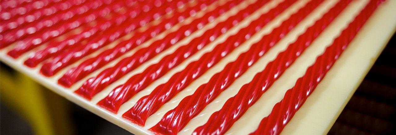 Twizzlers candy laying in a row