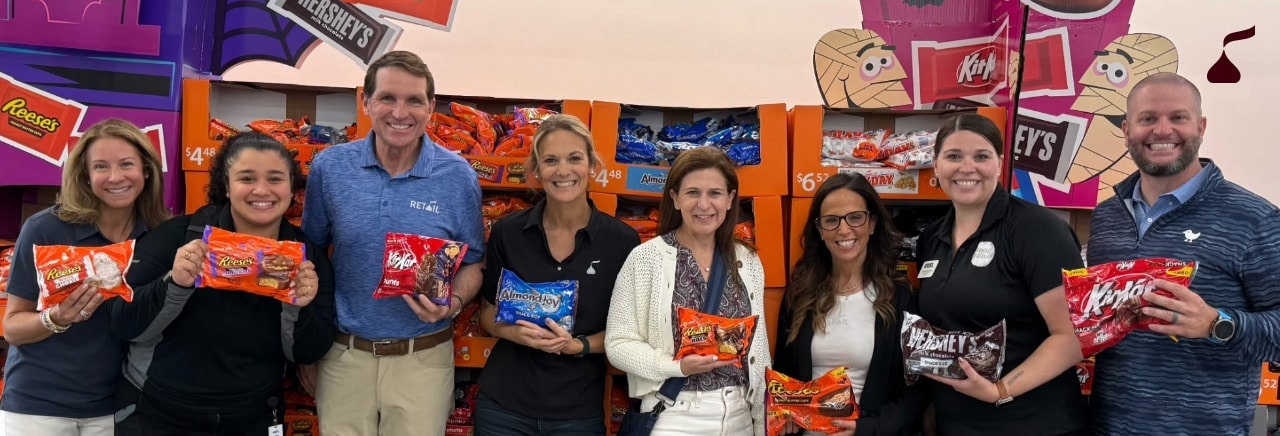 Kirk Tanner talking with team members