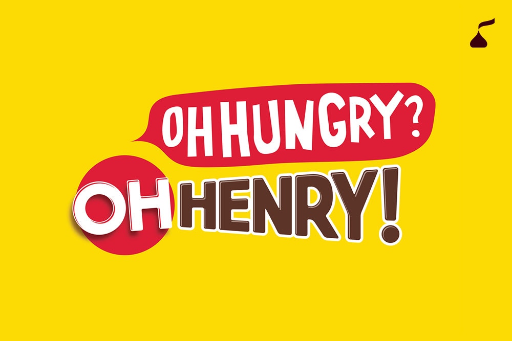 OH HENRY! logo with an “Oh hungry?” speech bubble on a bright yellow background