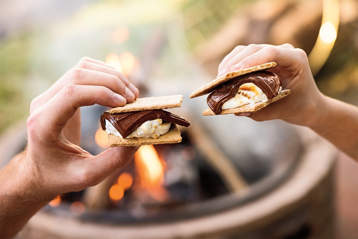 Hands holding a s'more