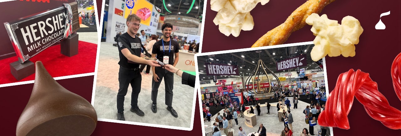 People handing out Hershey bars at the Sweets and Snacks Expo