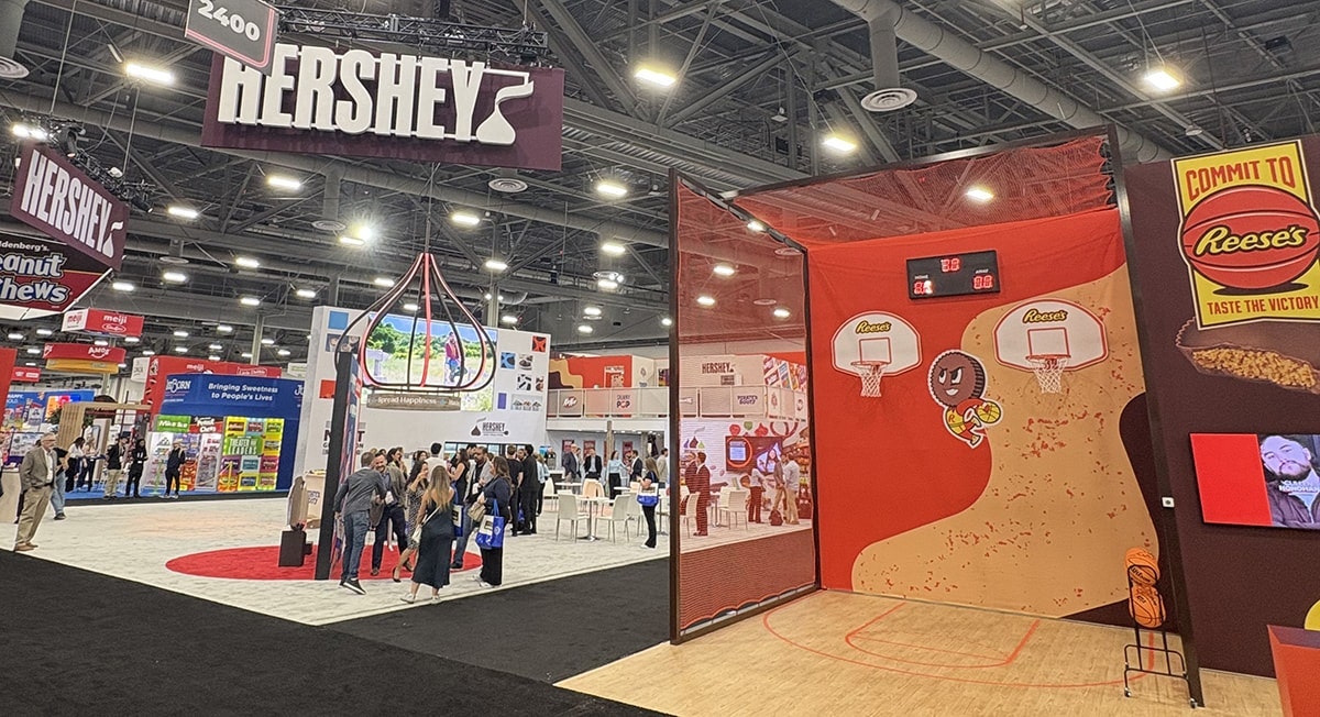 The Hershey booth at the 2026 Sweets & Snacks Expo in Las Vegas, featuring the Reese’s + NCAA activation and Hershey Insights Center.
