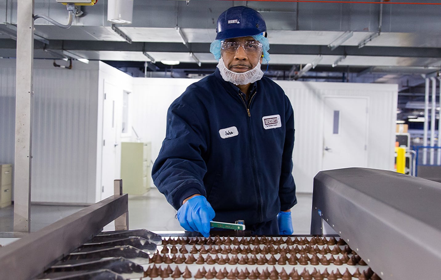 Person inspecting chocolate