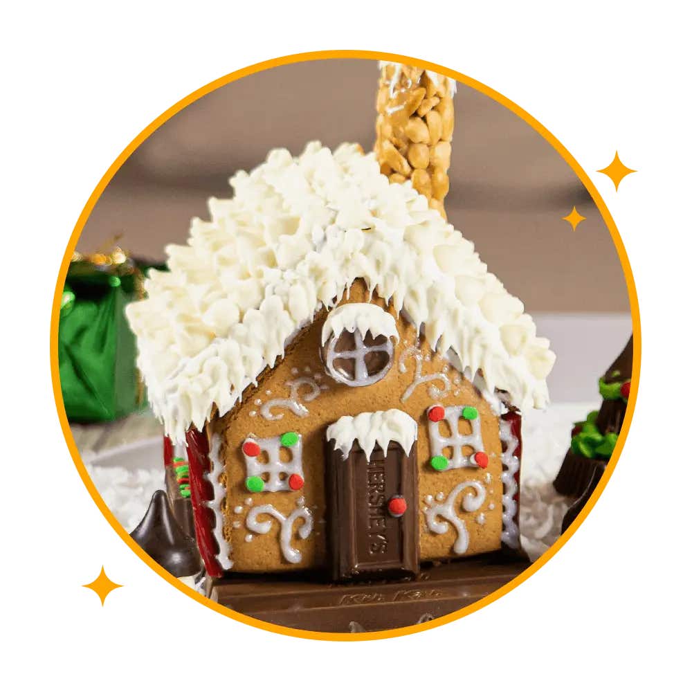 gingerbread house decorated with assorted hersheys candies