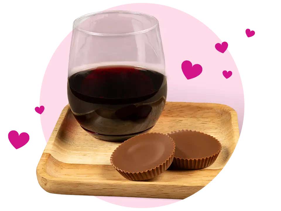 glass of wine paired with reeses milk chocolate peanut butter cups