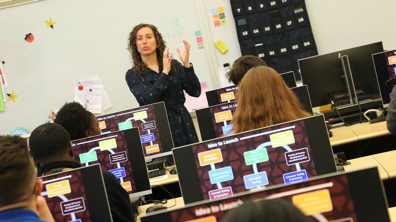Teacher teaching a class of students