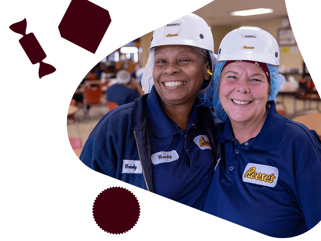 Two. Hershey's team members posing for a photo